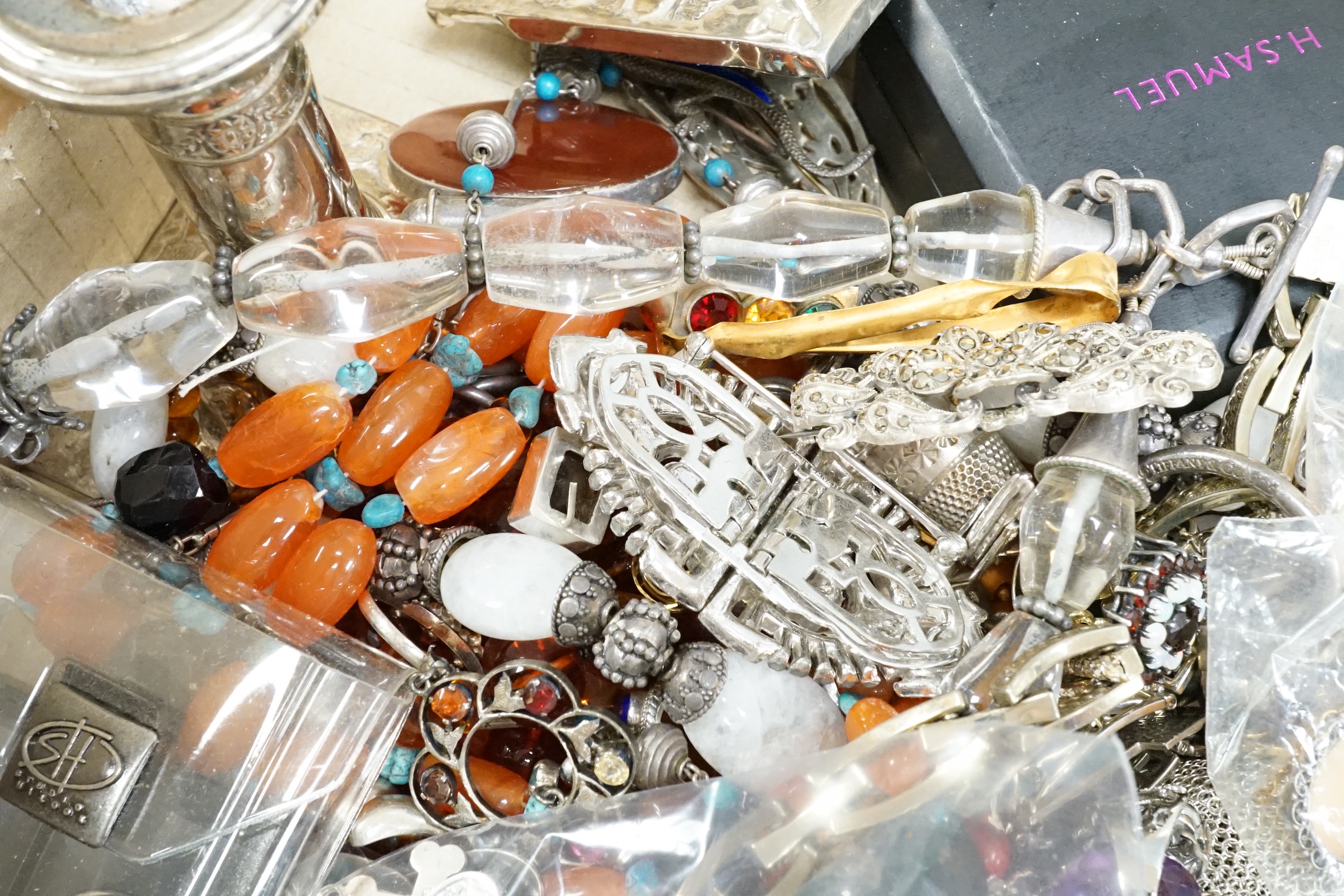A quantity of assorted jewellery, including silver, white metal and costume and a pair of silver mounted dwarf candlesticks(a.f.).